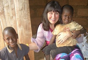Dr Susan Wilson with two children helped by the charity she founded